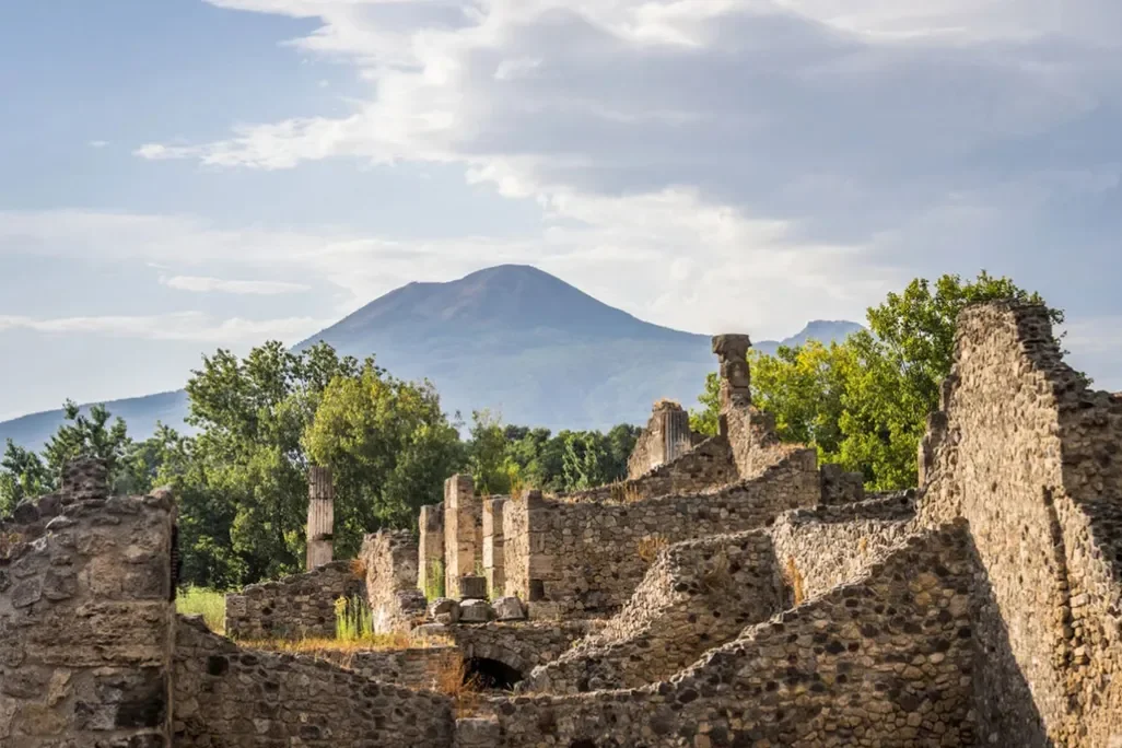 Ruins of houses in Pompeii, with a view of Mount Vesuvius to the north
